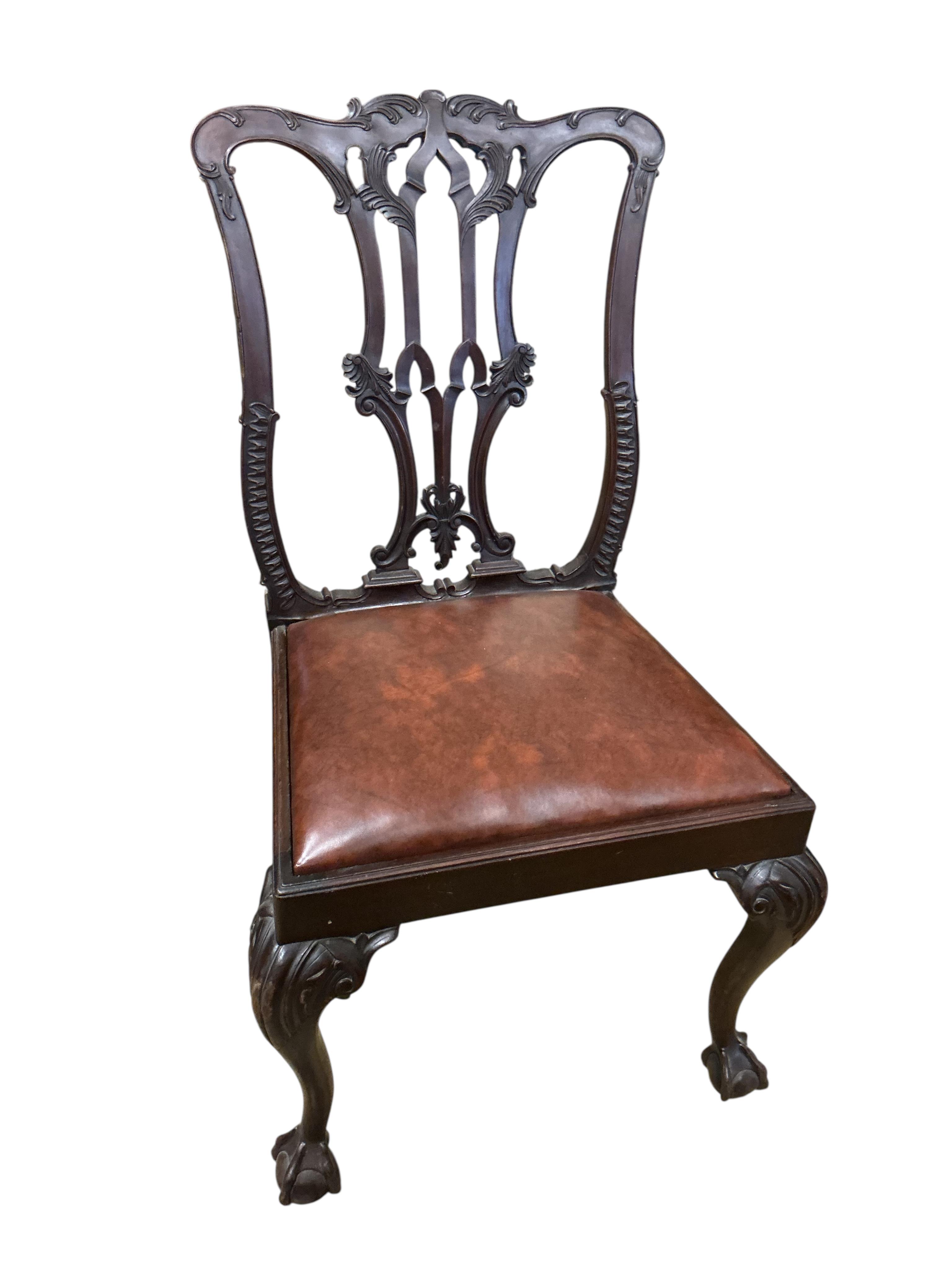A set of six Chippendale Revival mahogany dining chairs, two with arms